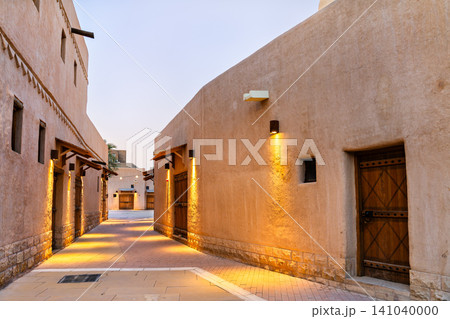 Historic mud brick alleyway with traditional architecture and lights in the old town of Ad Dirah, Riyadh, Saudi Arabia. 141040000