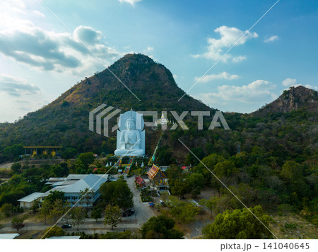 Aerial of white big Buddha front of the big mountain Aerial of white big Buddha front of the big mountain 141040645