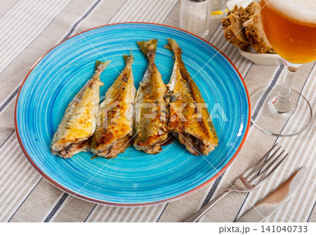 Serving of grilled horse mackerel with beer and bread Serving of grilled horse mackerel with beer and bread 141040733