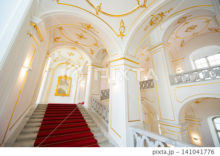 Interior of Bratislava Castle. Stone staircase and red carpet. Slovakia Interior of Bratislava Castle. Stone staircase and red carpet. Slovakia 141041776