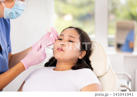 Doctor doing anti-aging beauty procedures 141041941
