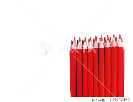 A set of red colored pencils on a white background. A set of red colored pencils on a white background. 141042376