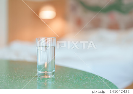 glass of clean mineral water on table at home, pure water for hydration and wellness, fresh skin care, daily routine water intake, Refreshment and lifestyle concept glass of clean mineral water on table at home, pure water for hydration and wellness, fresh skin care, daily routine water intake, Refreshment and lifestyle concept 141042422
