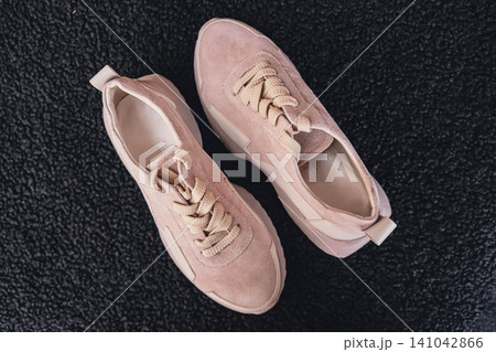 Fresh beige leather sneakers without brand marks displayed. For design templates online shops and sustainability-themed marketing. Clean blank sneakers Fresh beige leather sneakers without brand marks displayed. For design templates online shops and sustainability-themed marketing. Clean blank sneakers 141042866