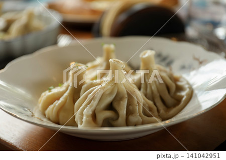 Steamed dumplings present on a plate in Bali 141042951