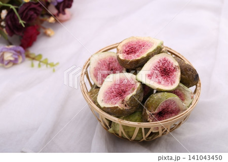 Dried Figs in a Woven Basket 141043450
