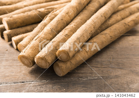 Fresh Burdock Root on Wooden Table Fresh Burdock Root on Wooden Table 141043462