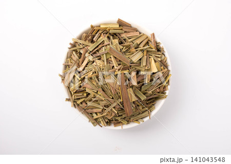 Dried Lemongrass Herbs in a White Bowl Dried Lemongrass Herbs in a White Bowl 141043548