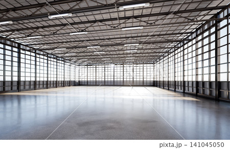 Empty factory interior filled with natural light 141045050