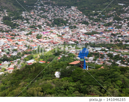 City view from hilltop showing buildings and a large sculpture City view from hilltop showing buildings and a large sculpture 141046285