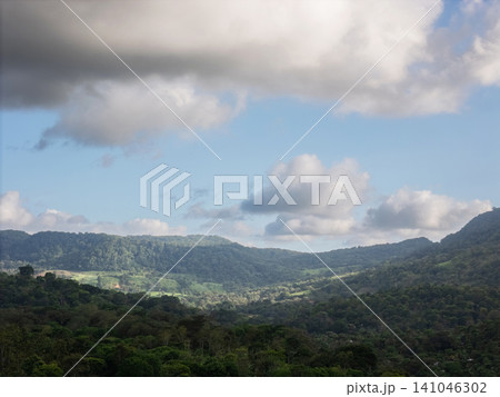 Clouds above green hills in Nicaragua during the day 141046302