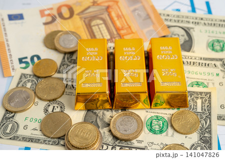 Gold bar on US dollar and Euro banknote, economy finance exchange trade investment. Gold bar on US dollar and Euro banknote, economy finance exchange trade investment. 141047826