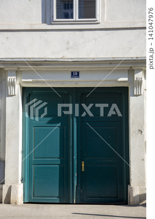 Vienna, Austria - June 13, 2023: Entrance door to the house on Penzinger Street in the center of Vienna Vienna, Austria - June 13, 2023: Entrance door to the house on Penzinger Street in the center of Vienna 141047976