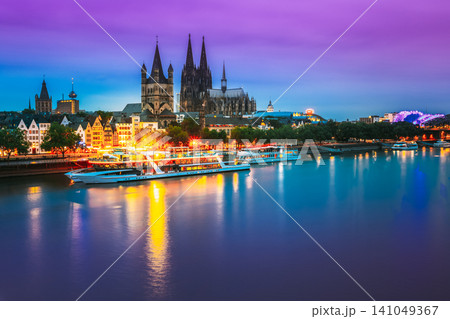 Cologne, Germany. Great St. Martin Church And Dom In Cologne At Evening With Reflection In River Rhine. Evening Blue Hour 141049367