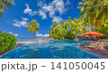 Beautiful tropical beach, sun loungers, red umbrella, palm trees, turquoise lagoon. Luxury summer resort paradise, romantic couple getaway escape. Relaxing honeymoon travel destination wallpaper 141050045
