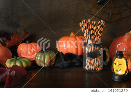 Halloween pumpkin head jack-o-lantern on wooden background Halloween pumpkin head jack-o-lantern on wooden background 141051279
