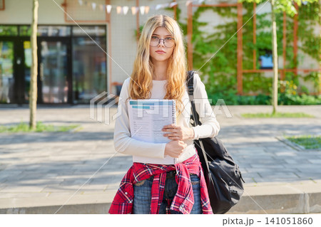 Teenage student girl in front of school building 141051860