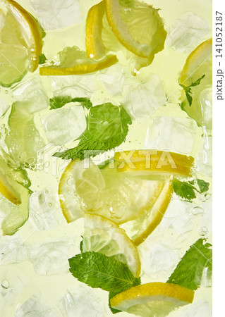 Refreshing lemonade with lemon slices mint leaves and ice cubes. 141052187