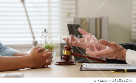 Close up of lawyer gesturing during legal consultation with client 141052276