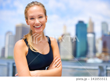 Workout, portrait and woman with arms crossed for fitness, morning exercise or running competition in city. Smile, wellness and face of female person for cardio, energy and confidence in New York Workout, portrait and woman with arms crossed for fitness, morning exercise or running competition in city. Smile, wellness and face of female person for cardio, energy and confidence in New York 141053311
