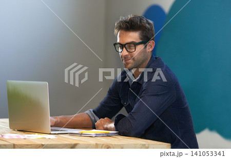 Smile, creative and man at laptop thinking for ideas, online research and reading email in office with glasses. Brainstorming, computer and designer at desk with business plan in professional career Smile, creative and man at laptop thinking for ideas, online research and reading email in office with glasses. Brainstorming, computer and designer at desk with business plan in professional career 141053341