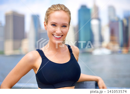 Woman, portrait and confident in city for workout morning routine, wellness and fitness for active cardio. Female person, happy and runner or athlete for sports hobby or training exercise in New York Woman, portrait and confident in city for workout morning routine, wellness and fitness for active cardio. Female person, happy and runner or athlete for sports hobby or training exercise in New York 141053574