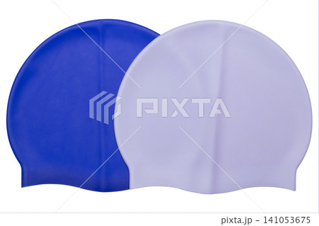 Two silicone swimming caps in blue and lavender colors isolated on white background, group of colorful waterproof swim hats Two silicone swimming caps in blue and lavender colors isolated on white background, group of colorful waterproof swim hats 141053675