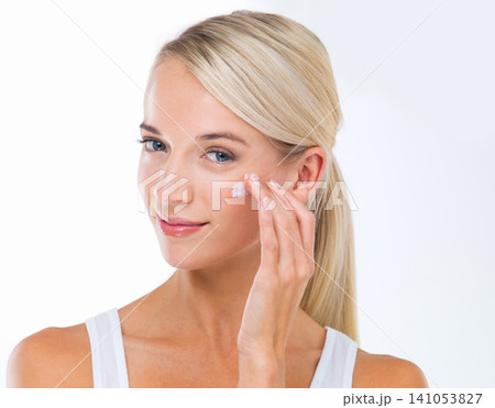 Woman, portrait and skincare lotion in studio or moisturizer wellness with dermatology, product or white background. Female person, cream and facial sunscreen or self care, protection or mockup space 141053827