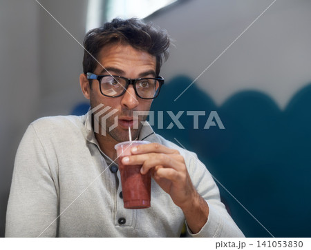 Man, relax or vision as thinking, drink or planning of natural brain food as healthy milkshake. Entrepreneur, idea or fruit smoothie in coffee shop to dream of organic, nutrition or detox opportunity Man, relax or vision as thinking, drink or planning of natural brain food as healthy milkshake. Entrepreneur, idea or fruit smoothie in coffee shop to dream of organic, nutrition or detox opportunity 141053830