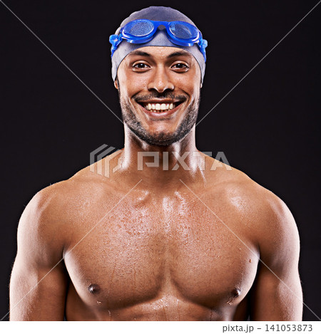 Studio, swimmer and man smile for portrait, sport and workout for training and exercise for body. Athlete, adult and male person withs strength, professional and champion in black background Studio, swimmer and man smile for portrait, sport and workout for training and exercise for body. Athlete, adult and male person withs strength, professional and champion in black background 141053873