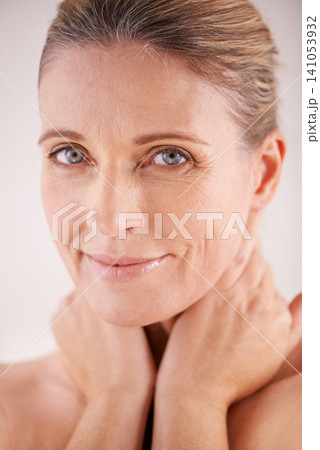 Glow, portrait or mature woman with beauty, confidence or facial treatment in studio on white background. Face, skincare benefits or model with natural shine, smile or anti aging cosmetics results 141053932