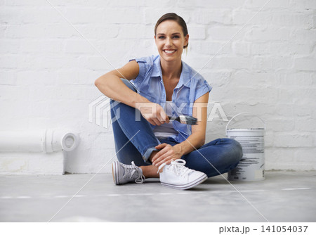 Woman, portrait and smile for painting renovation in home, remodeling and maintenance in apartment. Female person, floor and equipment for project upgrade, do it yourself and tool for house repairs 141054037
