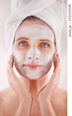 Spa, mask or woman in portrait for facial, skincare in studio with natural detox or cosmetics with towel. Model, confidence or face with lotion for anti aging treatment or beauty on white background Spa, mask or woman in portrait for facial, skincare in studio with natural detox or cosmetics with towel. Model, confidence or face with lotion for anti aging treatment or beauty on white background 141054096