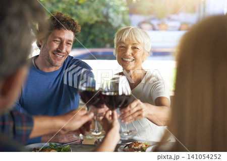 Family, lunch and cheers with wine, celebration and bonding together with joy and weekend break. Group, generations and smile with food or alcohol with meal or relaxing with love and social gathering Family, lunch and cheers with wine, celebration and bonding together with joy and weekend break. Group, generations and smile with food or alcohol with meal or relaxing with love and social gathering 141054252