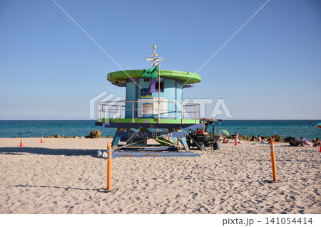 Front View of Green Lifeguard Tower Between Orange Safety Cones Front View of Green Lifeguard Tower Between Orange Safety Cones 141054414