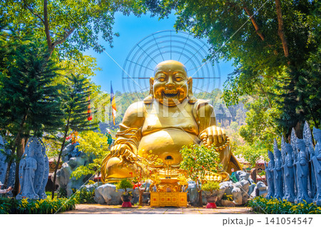Big golden Buddha statue in the garden at Linh An Buddhist Pagoda in Dalat in Vietnam in Asia Big golden Buddha statue in the garden at Linh An Buddhist Pagoda in Dalat in Vietnam in Asia 141054547