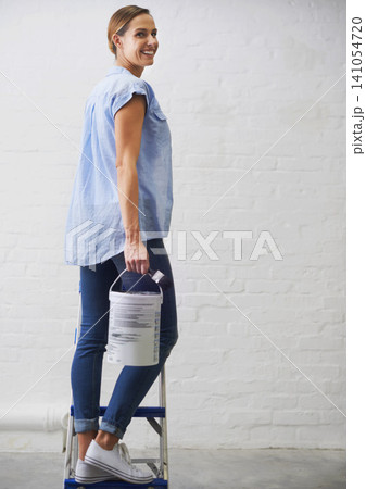 Woman, portrait and paintbrush for renovation in home, remodeling and maintenance in apartment. Female person, ladder and equipment for interior upgrade, diy and tool for house repairs or project Woman, portrait and paintbrush for renovation in home, remodeling and maintenance in apartment. Female person, ladder and equipment for interior upgrade, diy and tool for house repairs or project 141054720