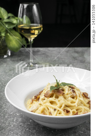 spaghetti carbonara creamy pasta with bacon and chesse on restaurant table spaghetti carbonara creamy pasta with bacon and chesse on restaurant table 141055386
