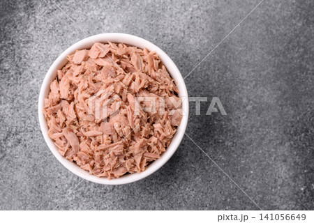 Fish, canned tuna chunks in brine for sandwiches and salads. Canned tuna Fish, canned tuna chunks in brine for sandwiches and salads. Canned tuna 141056649