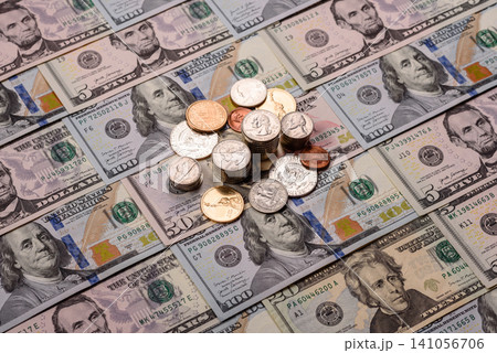 Paper US dollar bills of various denominations and cent coins as a business tool. Cash US dollars Paper US dollar bills of various denominations and cent coins as a business tool. Cash US dollars 141056706