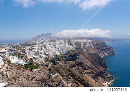Panoramic view of Fira town and caldera cliffs in Santorini Greece Panoramic view of Fira town and caldera cliffs in Santorini Greece 141057566