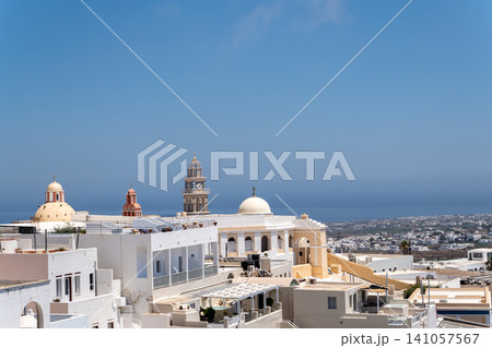 Saint John the Baptist Cathedral with clock tower in Fira Santorini Saint John the Baptist Cathedral with clock tower in Fira Santorini 141057567