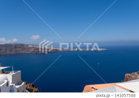 Panoramic view of volcanic caldera and Thirasia island from Santorini Panoramic view of volcanic caldera and Thirasia island from Santorini 141057588