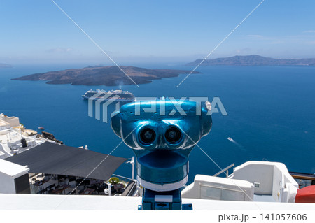 Tourist coin operated binoculars looking at Santorini caldera Greece 141057606