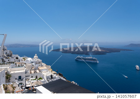 Panoramic view of Fira village and cruise ship in Santorini Panoramic view of Fira village and cruise ship in Santorini 141057607