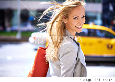 Woman, portrait and smile with street, walk and commute for work or career. Designer, job and new york city with urban, summer and happiness with confident and creative business travel in downtown Woman, portrait and smile with street, walk and commute for work or career. Designer, job and new york city with urban, summer and happiness with confident and creative business travel in downtown 141057847