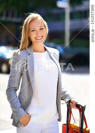 Businesswoman, portrait and luggage for city travel for corporate trip, commute or airport. Female person, face and smile with suitcase or urban hotel building or downtown job, pedestrian or career Businesswoman, portrait and luggage for city travel for corporate trip, commute or airport. Female person, face and smile with suitcase or urban hotel building or downtown job, pedestrian or career 141057866