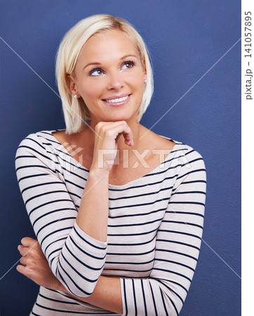 Smile, thinking and woman with idea, planning or problem solving in studio isolated on a blue background. Dream, vision and creative person with decision, inspiration or reflection to remember memory Smile, thinking and woman with idea, planning or problem solving in studio isolated on a blue background. Dream, vision and creative person with decision, inspiration or reflection to remember memory 141057895
