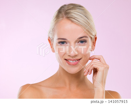 Woman, skincare and happy with touch in studio portrait with face, results and natural glow by pink background. Girl, person and model with cosmetics, facial wellness and transformation with beauty Woman, skincare and happy with touch in studio portrait with face, results and natural glow by pink background. Girl, person and model with cosmetics, facial wellness and transformation with beauty 141057915