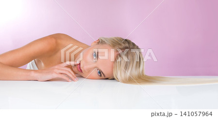 Studio, portrait and beauty of woman with skincare for health, glow and shine of skin of girl. Pink background, adult and female person with soft, face and results from dermatology and cosmetics Studio, portrait and beauty of woman with skincare for health, glow and shine of skin of girl. Pink background, adult and female person with soft, face and results from dermatology and cosmetics 141057964